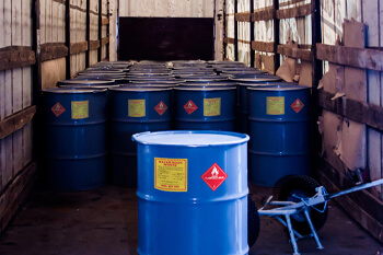 hazardous waste container with red DOT class 3 flammable label